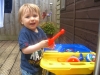 Aaron playing in the sand pit